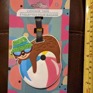 Colorful Silicone Luggage Tag Brown Sloth with a Green Hat Laying on Beach Ball